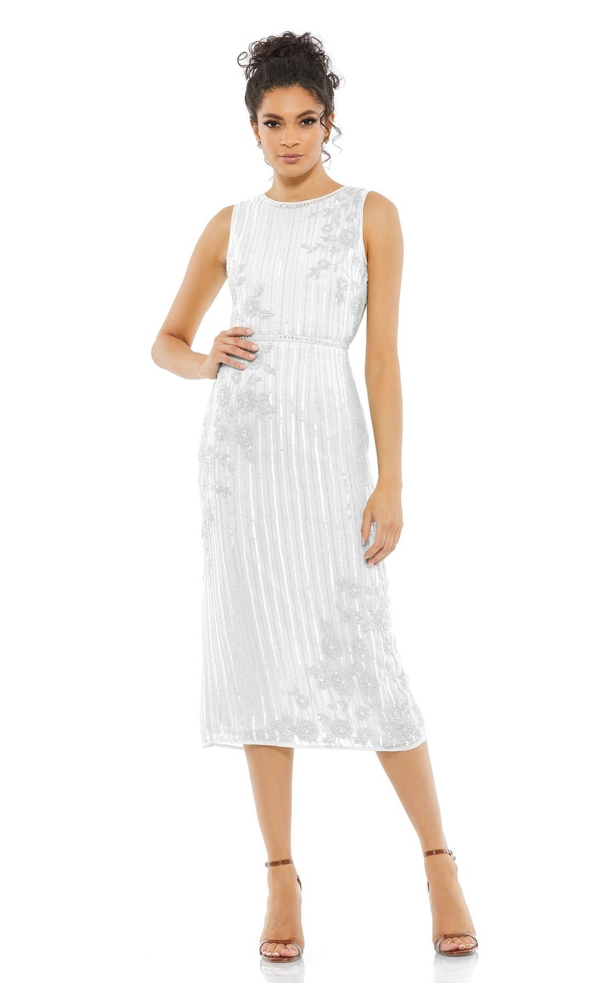 A woman wearing the Beaded Midi Wedding Guest Dress: Mac Duggal 70260, a sleeveless, tea-length dress with subtle floral patterns and vertical stripes, paired with strappy high-heeled sandals.